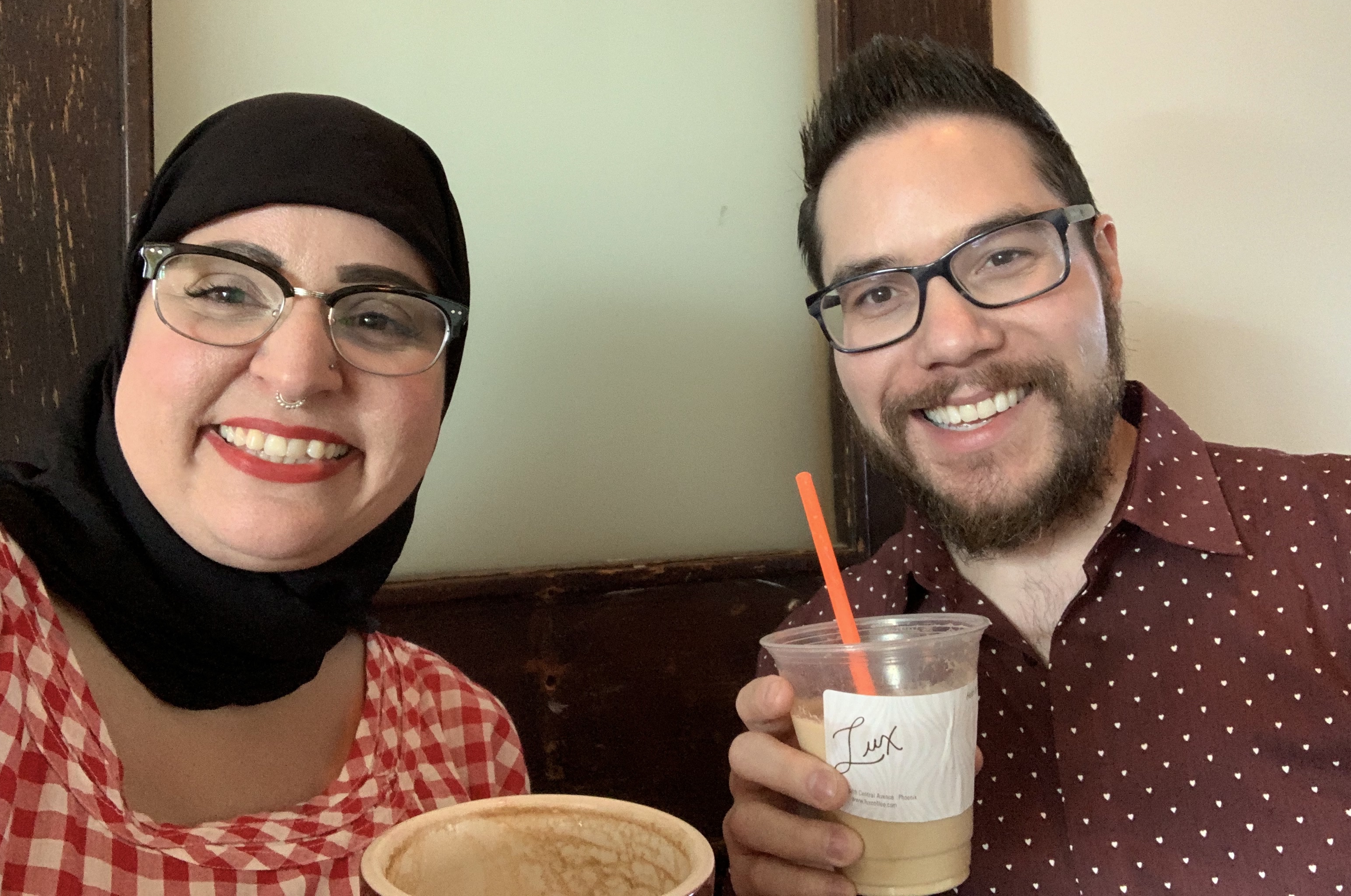 Mona and Eric sip coffee while planning for Annual Meeting 2019: Leading with Equity And Diversity (L.E.A.D.)