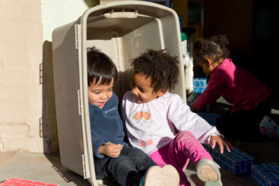 two little girls jumping